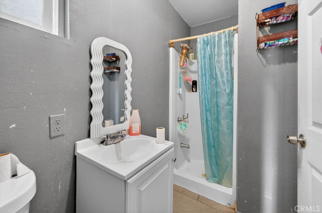 705 South C Madera, CA 93638 - Photo 48 of 50 a bathroom with a sink and a mirror