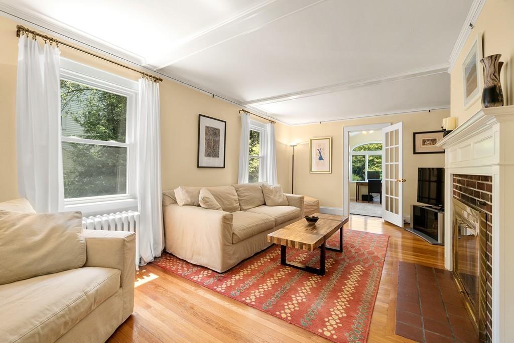 20 Cavanagh Road Wellesley, MA 02481 - Photo 12 of 28 a living room with furniture large window and a fireplace