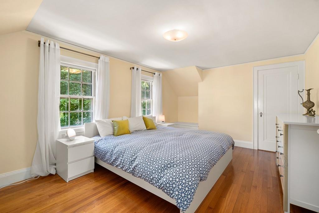 20 Cavanagh Road Wellesley, MA 02481 - Photo 18 of 28 a bedroom with a bed and wooden floor