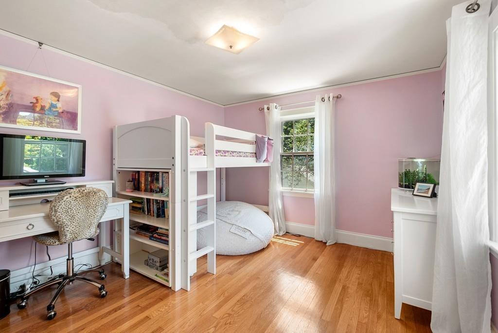 20 Cavanagh Road Wellesley, MA 02481 - Photo 20 of 28 a bedroom with furniture and a flat screen tv