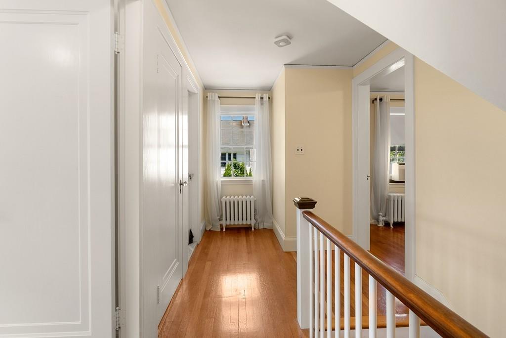 20 Cavanagh Road Wellesley, MA 02481 - Photo 23 of 28 a view of a hallway with a livingroom and a hall with wooden floor