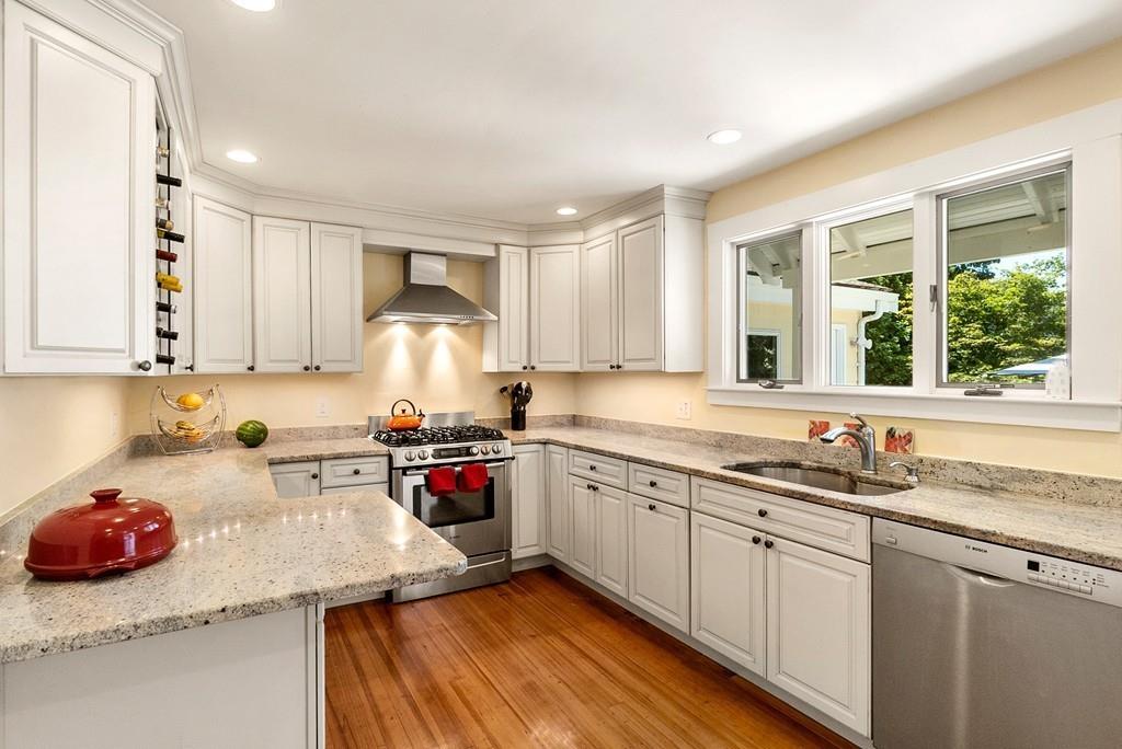 20 Cavanagh Road Wellesley, MA 02481 - Photo 8 of 28 a kitchen with a sink stove and cabinets