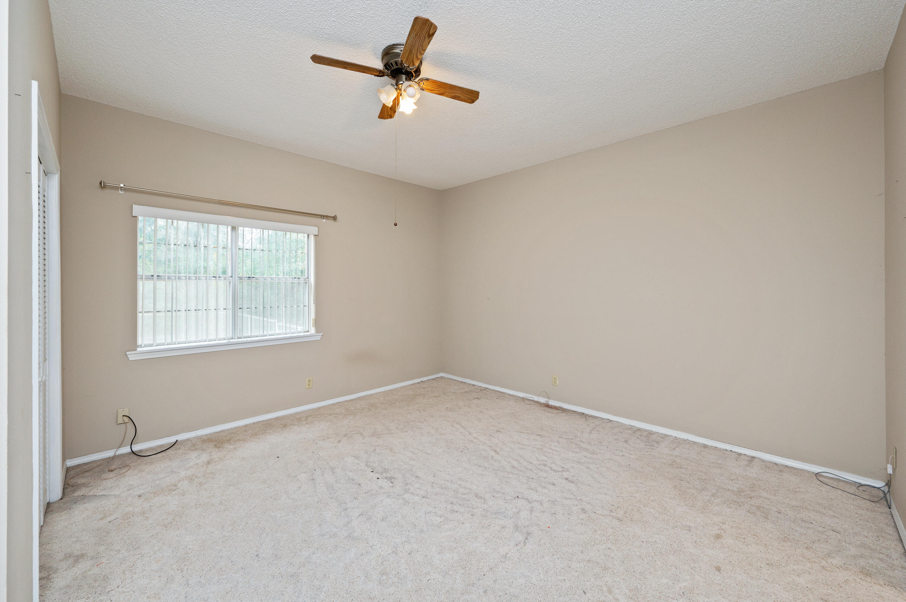 6433 Old River Road Baker, FL 32531 - Photo 16 of 27 an empty room with a window