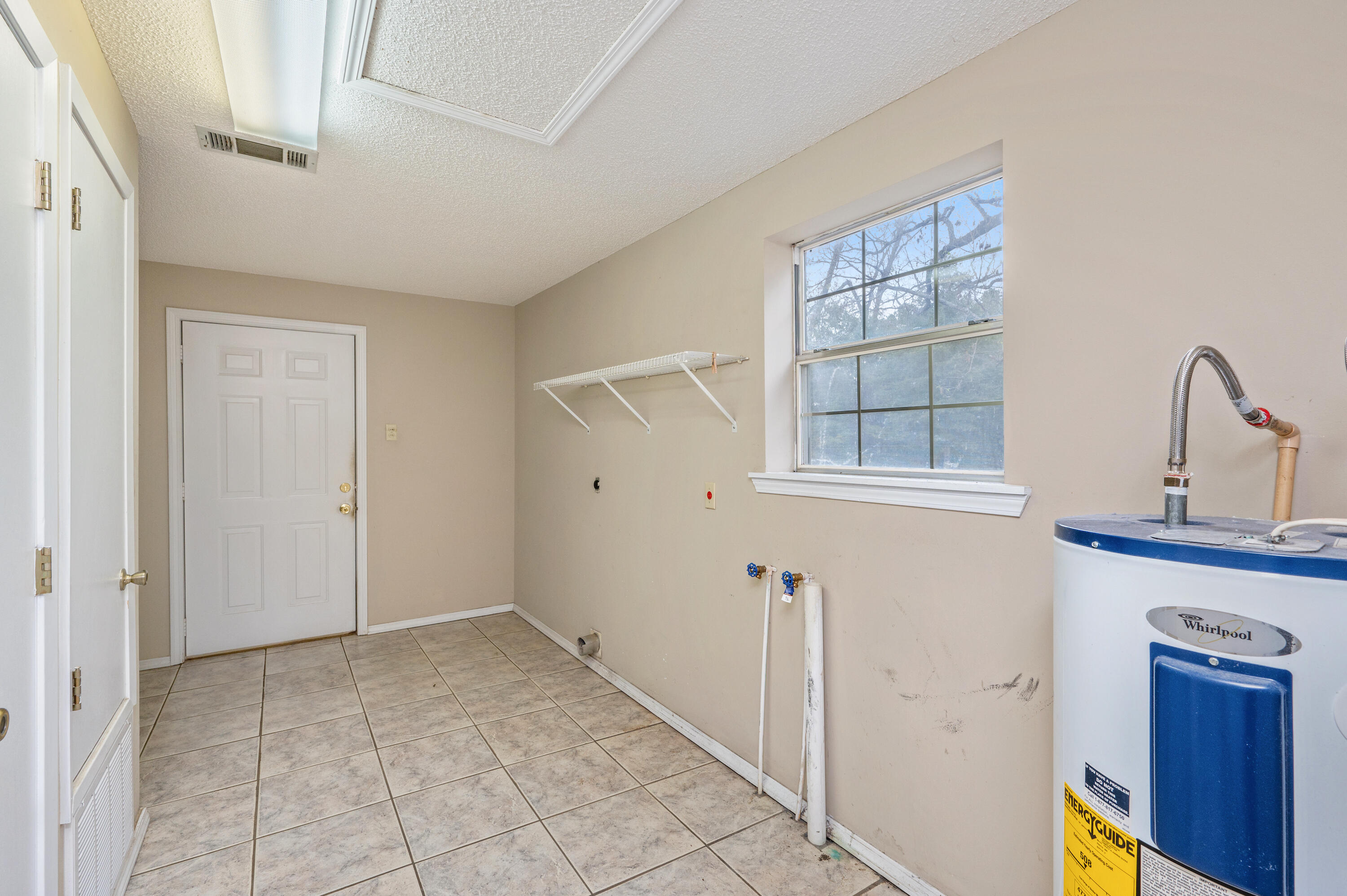 6433 Old River Road Baker, FL 32531 - Photo 23 of 27 an empty room with windows