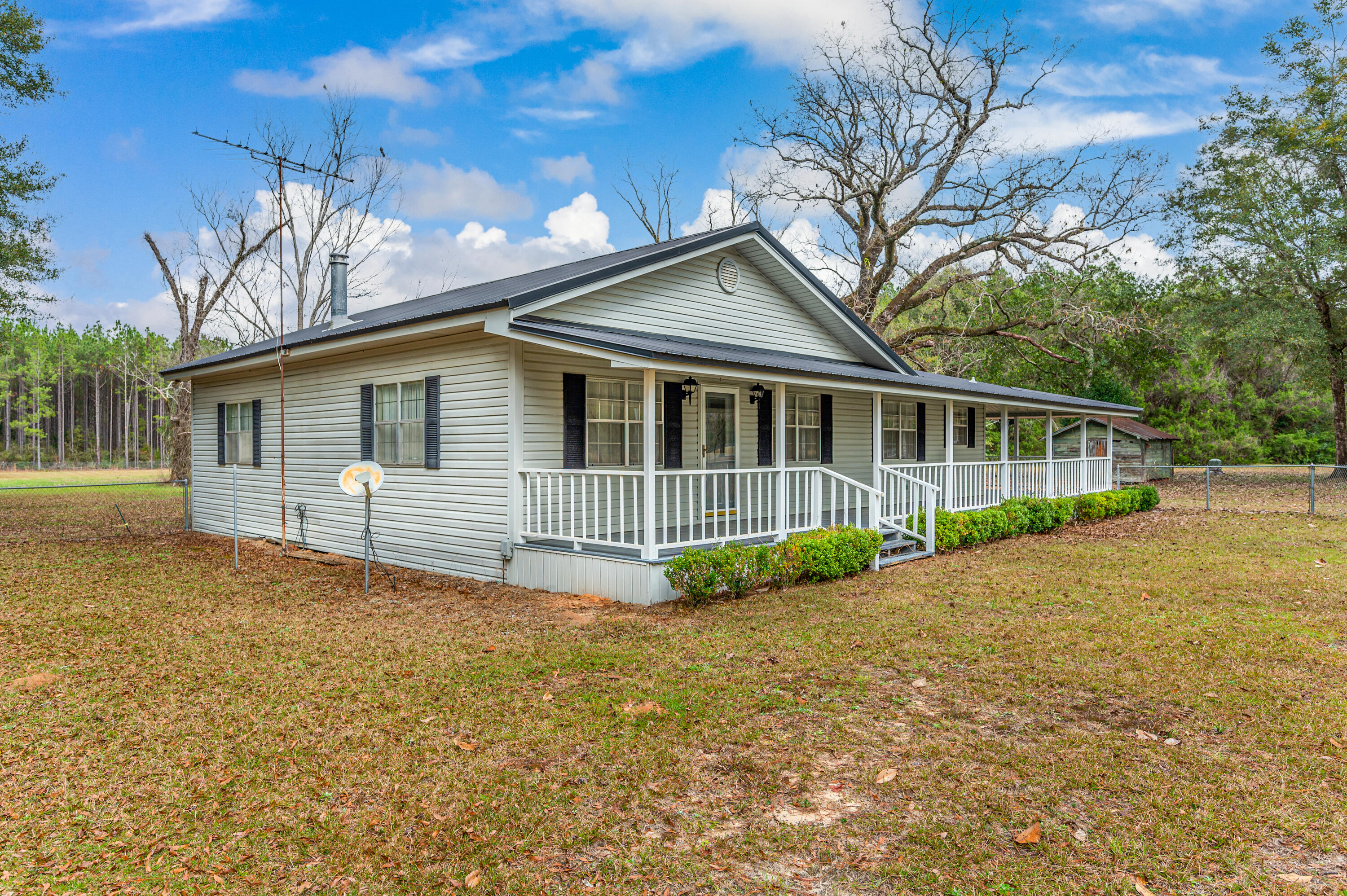 6433 Old River Road Baker, FL 32531 - Photo 4 of 27 a view of house with a yard