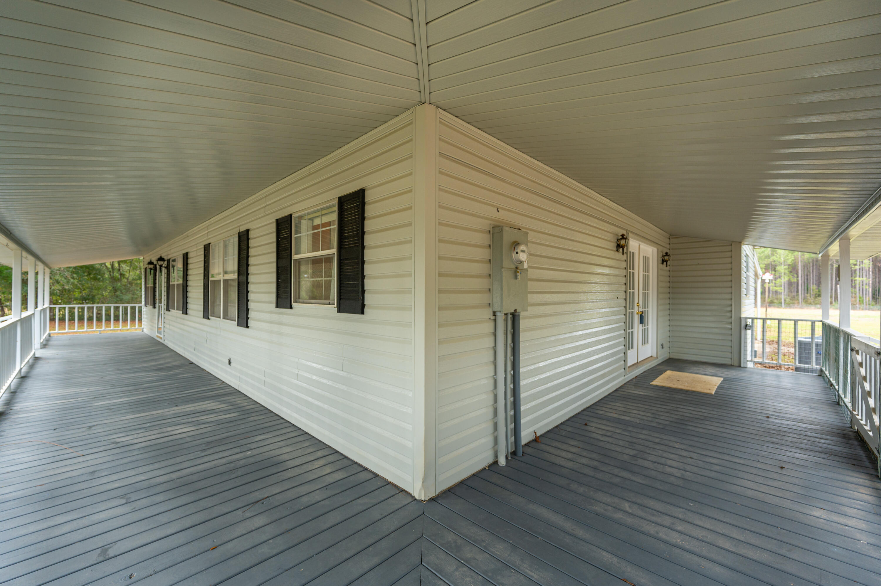 6433 Old River Road Baker, FL 32531 - Photo 5 of 27 a view of a house with wooden deck