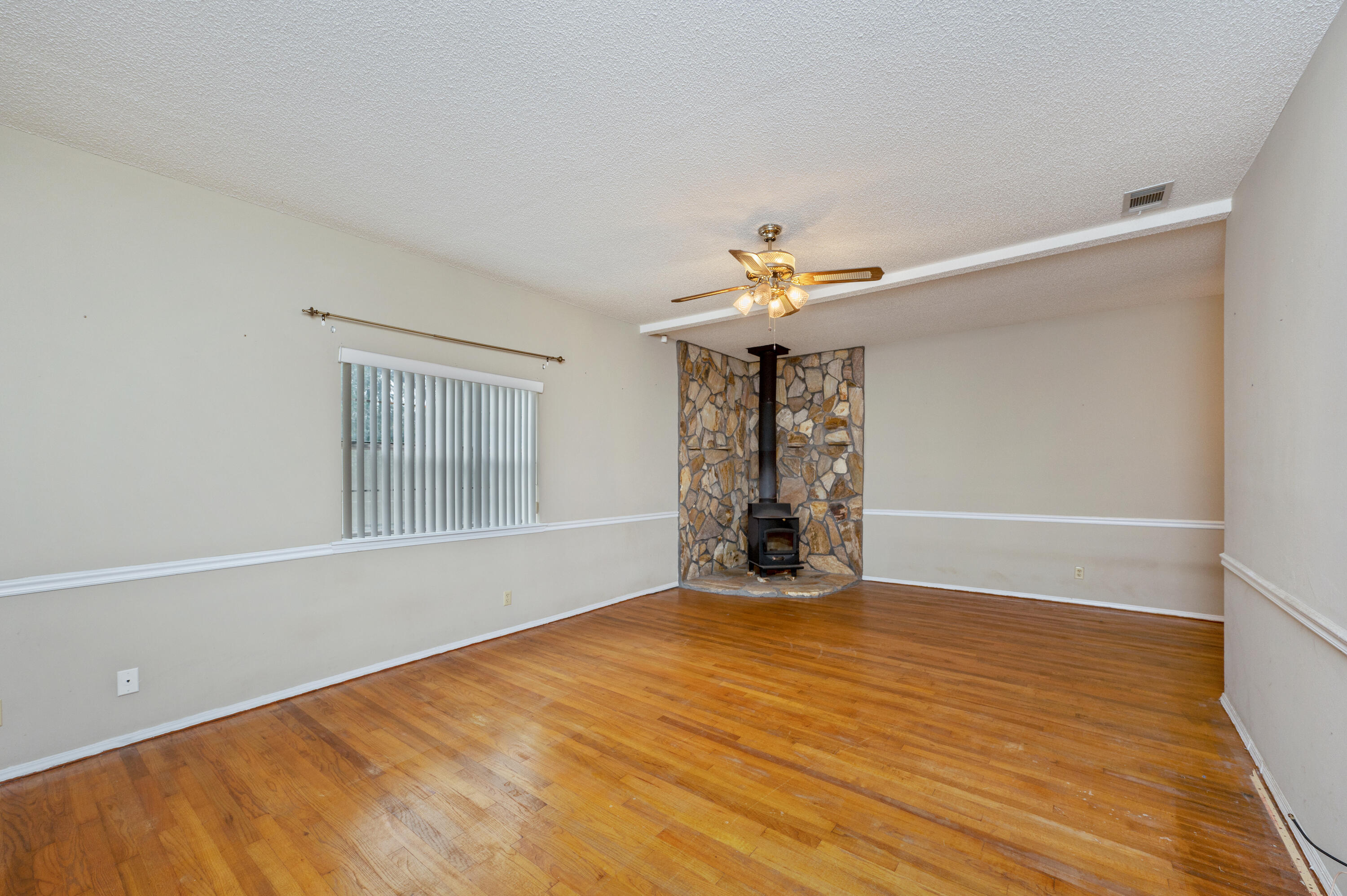6433 Old River Road Baker, FL 32531 - Photo 6 of 27 wooden floor in an empty room with a window
