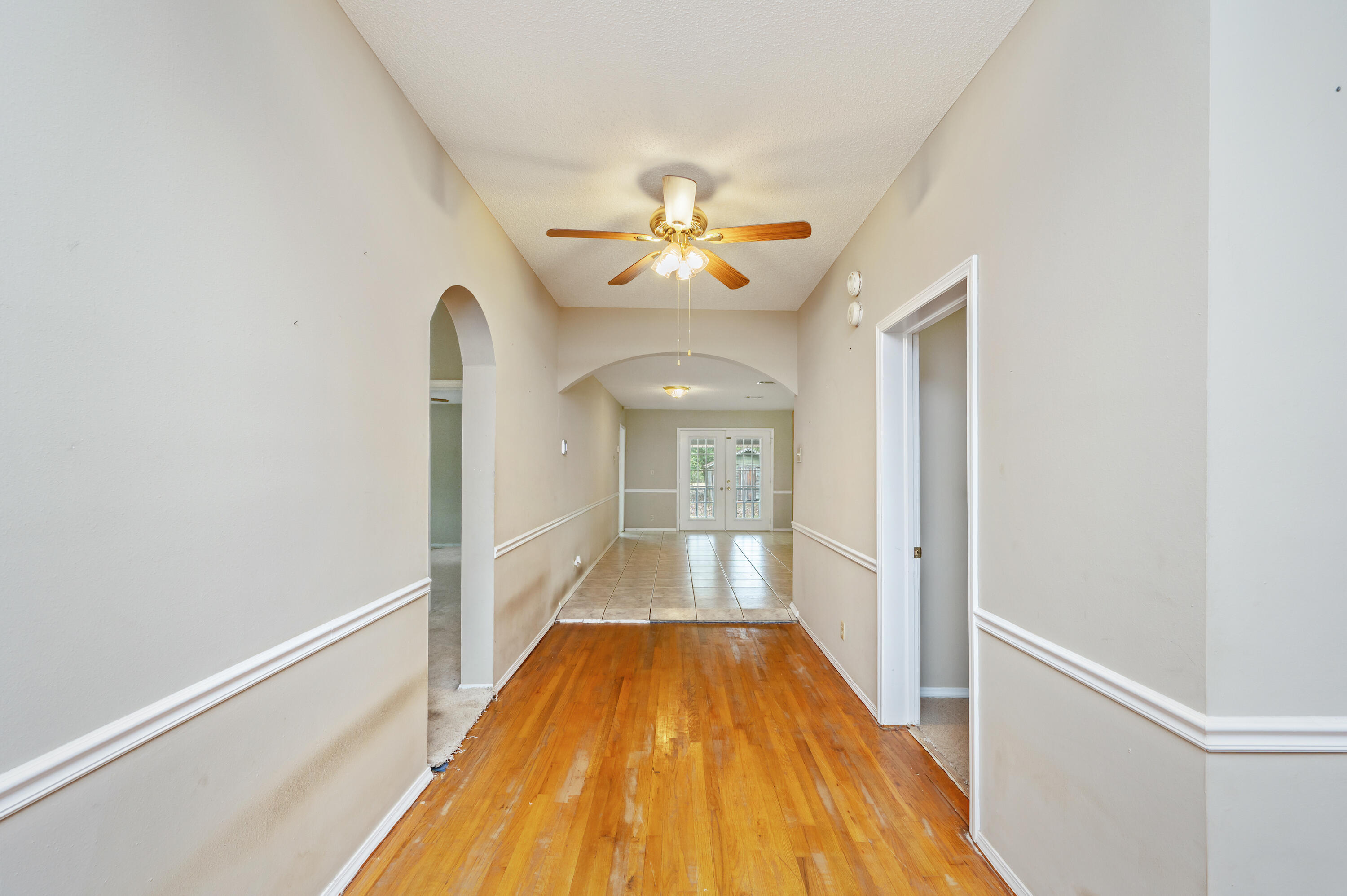 6433 Old River Road Baker, FL 32531 - Photo 8 of 27 a view of a hallway with a chandelier