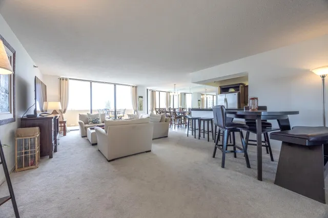 a living room with furniture and a table