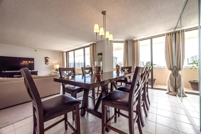 a view of a dining room with furniture window and outside view