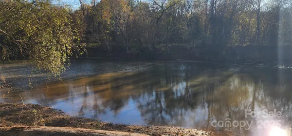 a bathroom with a sink and a shower curtain