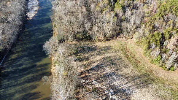 a view of a yard with trees
