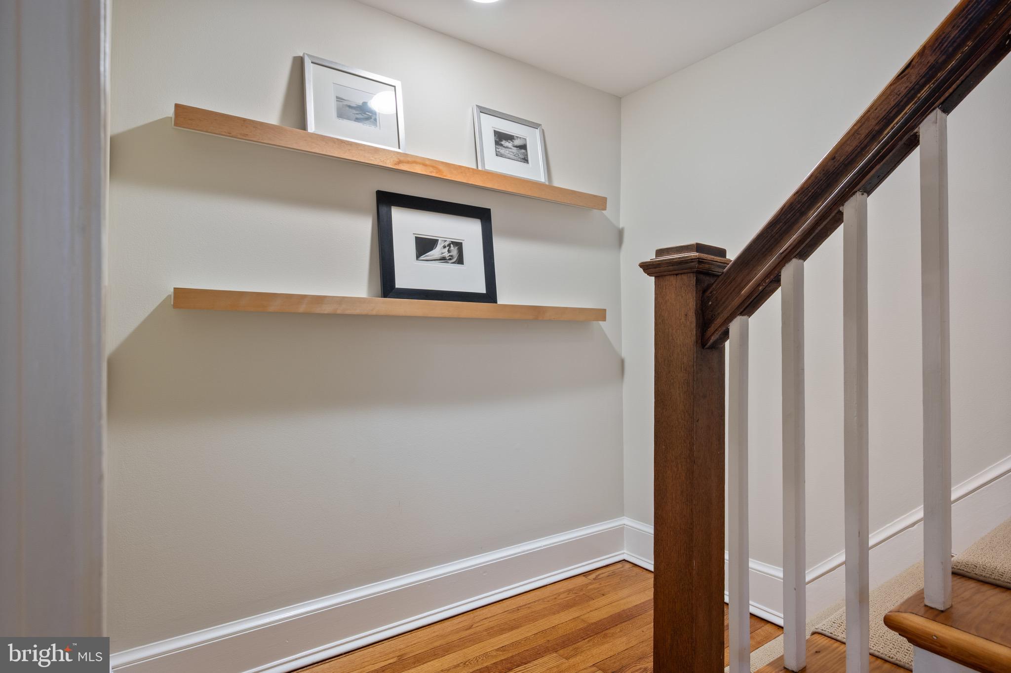 120 West Maple Street Alexandria, VA 22301 - Photo 52 of 100 a view of a hallway with paintings on the wall