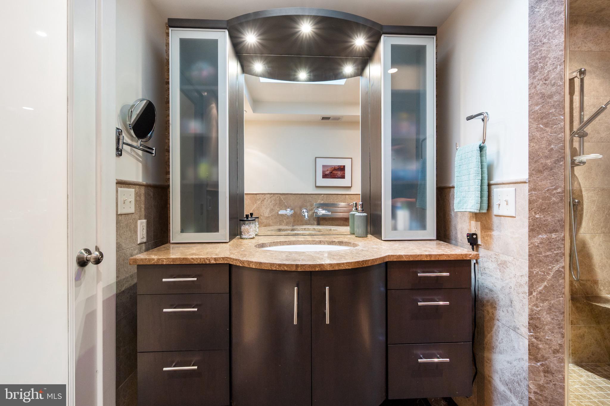 120 West Maple Street Alexandria, VA 22301 - Photo 56 of 100 a bathroom with a granite countertop sink and a mirror
