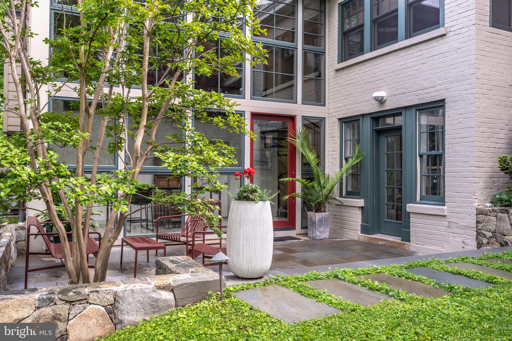 120 West Maple Street Alexandria, VA 22301 - Photo 85 of 100 a view of a patio with table and chairs and potted plants