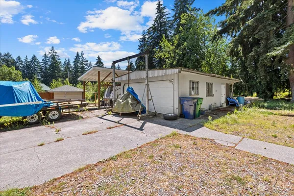 a view of a backyard with a sitting area