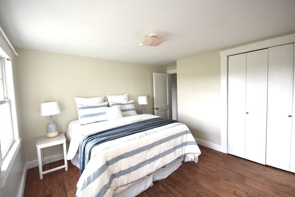 213 Marion Road Rochester, MA 02770 - Photo 13 of 18 a bedroom with a bed and a window