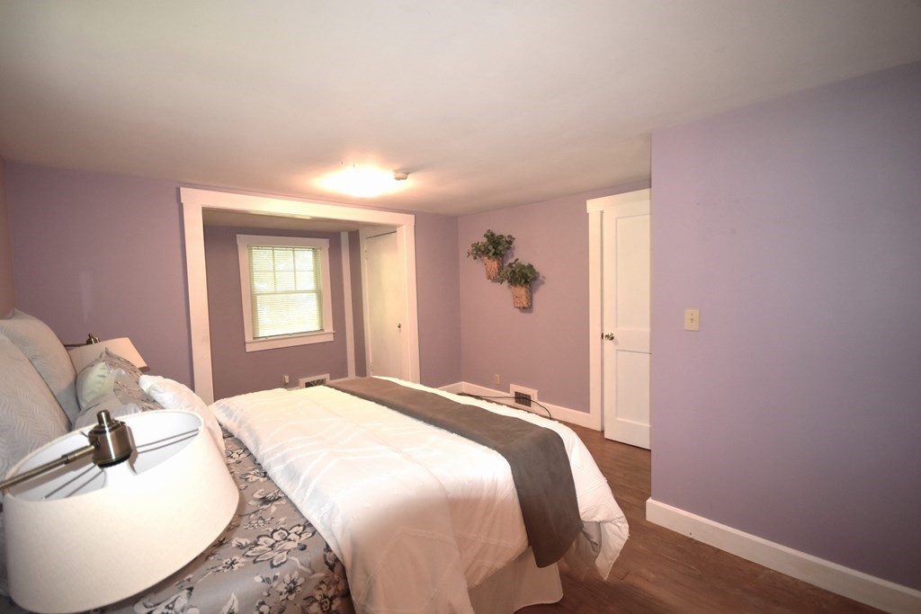 213 Marion Road Rochester, MA 02770 - Photo 14 of 18 a bedroom with a bed and a mirror
