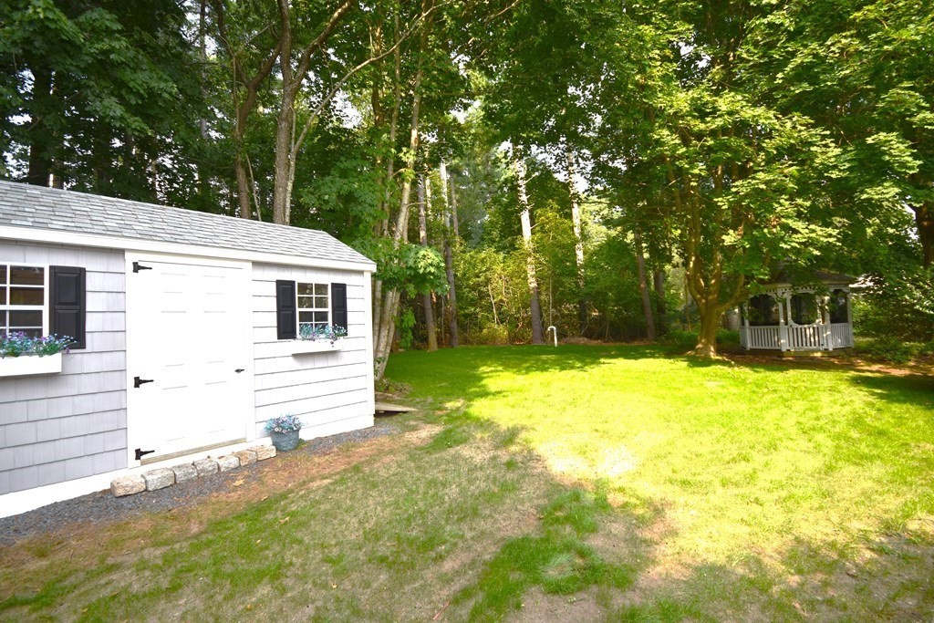213 Marion Road Rochester, MA 02770 - Photo 5 of 18 a front view of a house with a yard
