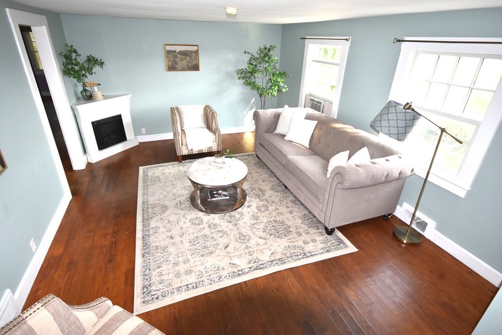 213 Marion Road Rochester, MA 02770 - Photo 6 of 18 a living room with furniture and a rug