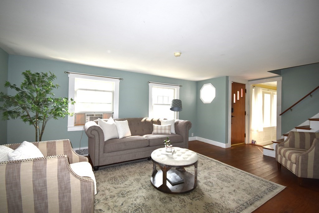 213 Marion Road Rochester, MA 02770 - Photo 7 of 18 a living room with furniture and a large window
