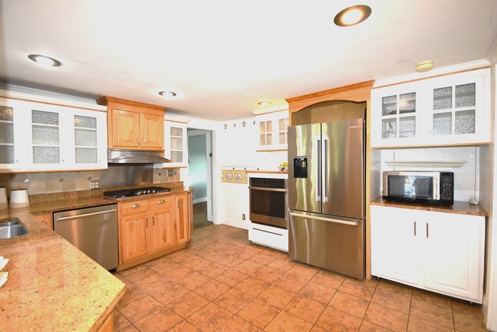 213 Marion Road Rochester, MA 02770 - Photo 9 of 18 a kitchen with stainless steel appliances granite countertop a refrigerator oven a sink and dishwasher