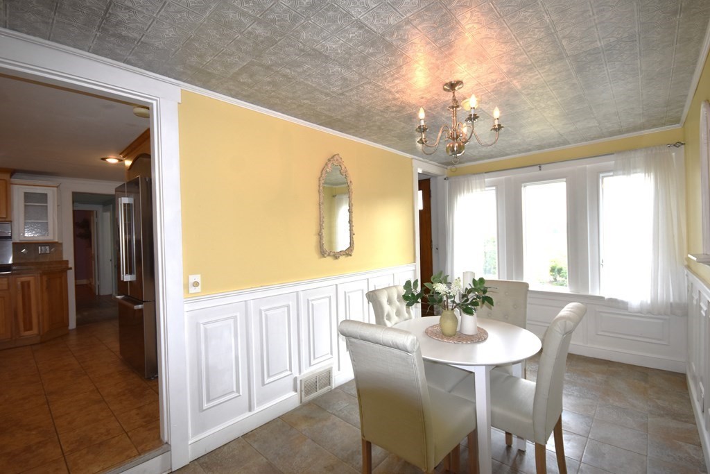 213 Marion Road Rochester, MA 02770 - Photo 10 of 18 a view of a dining room with furniture window and outside view