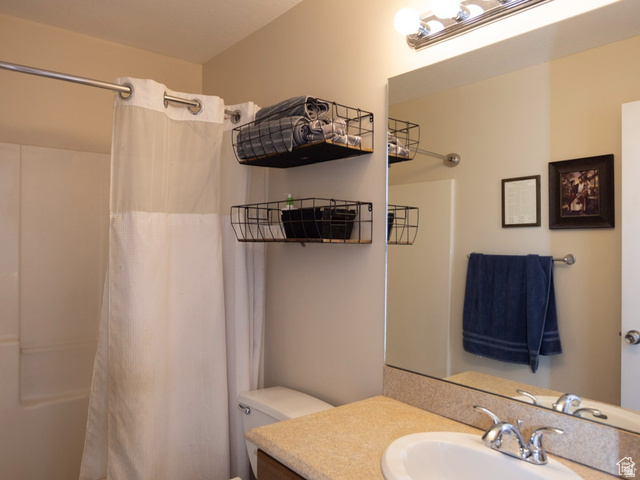 7532 North Castle Rock Road Eagle Mountain, UT 84005 - Photo 26 of 40 Bathroom with vanity and shower / bathtub combination with curtain