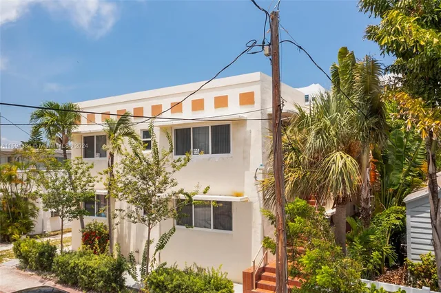 a view of a house with a tree