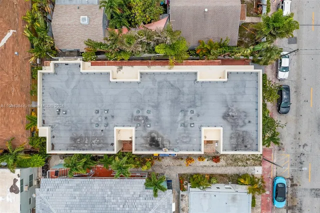 an aerial view of a house with outdoor space
