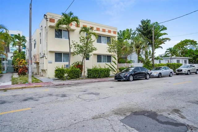 a view of multiple houses with a street