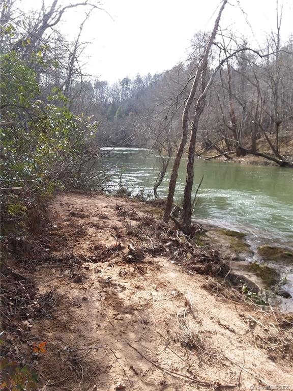 999 South Wilson Hill Road Mill Spring, NC 28756 - Photo 23 of 26 a view of a lake with lots of trees