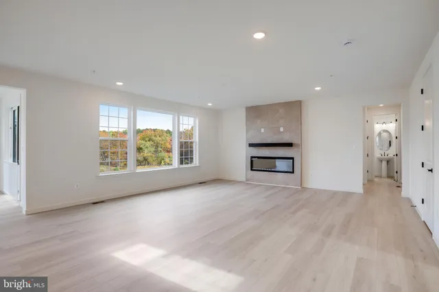 a large kitchen with stainless steel appliances kitchen island a large counter top a sink stainless steel appliances and cabinets