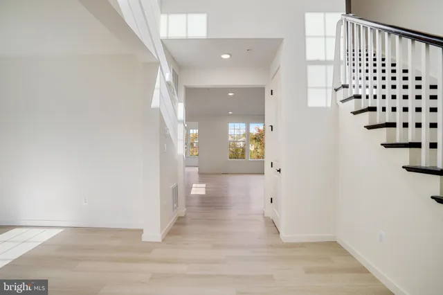 a view of an empty room with windows