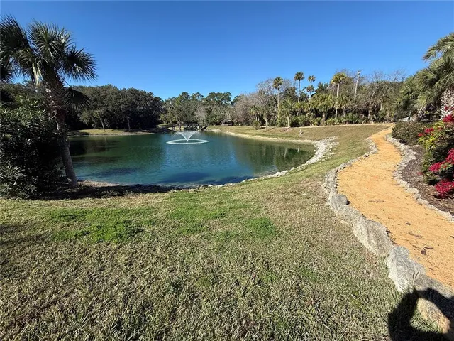 a view of a lake with a yard