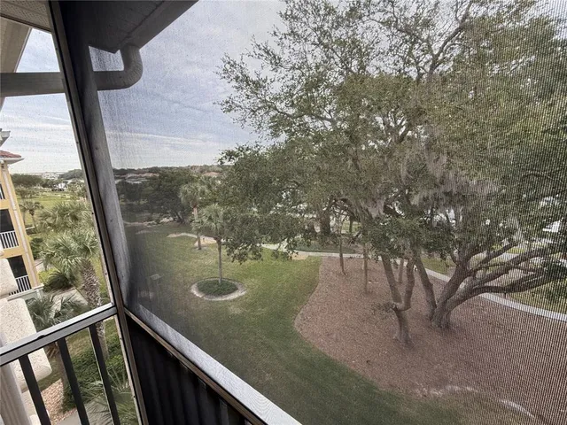 a view of swimming pool from a balcony