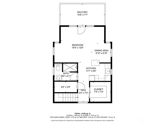 a picture of a bench in front of a wall