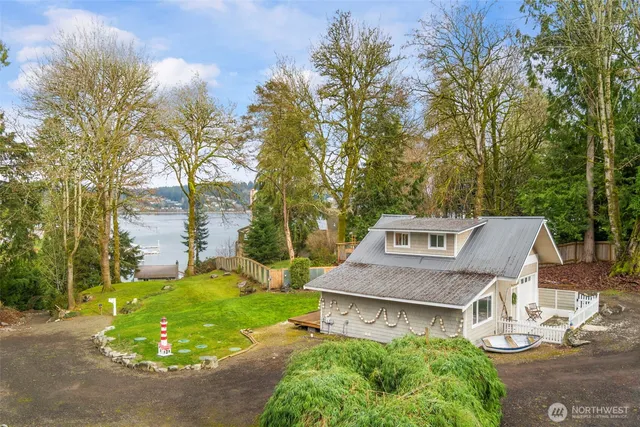 a aerial view of a house with garden and lawn chairs