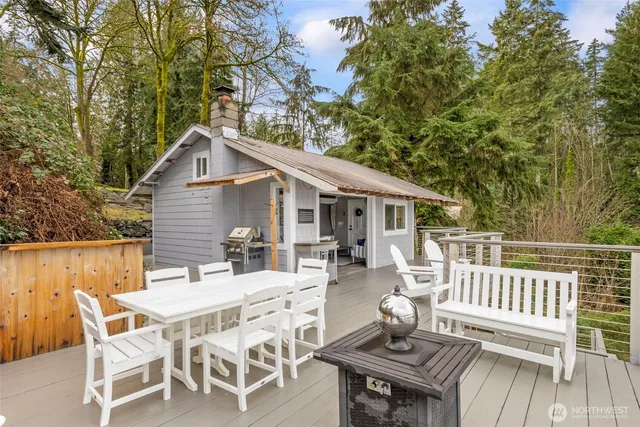 a view of a patio with a table and chairs