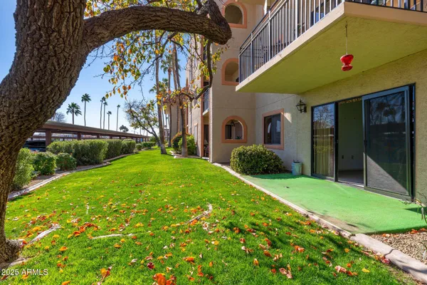 a view of a patio with swimming pool