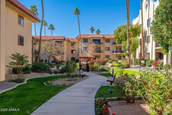 a view of a swimming pool and outdoor seating