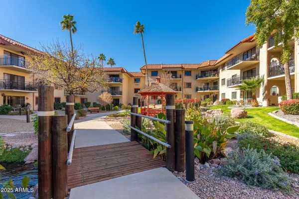 a building exterior with the table and chairs