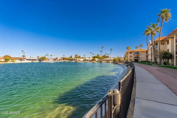 a room with a bed and a chandelier