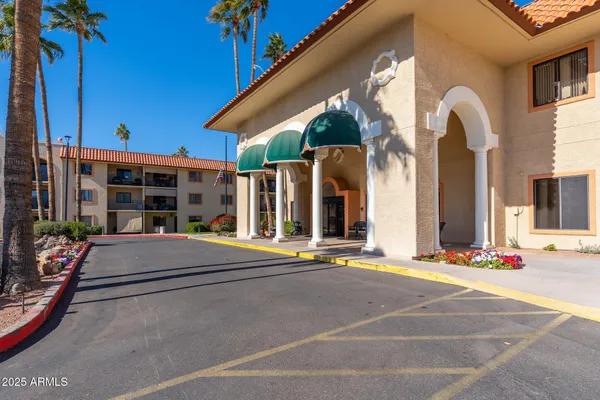 a living room with furniture and a book shelf