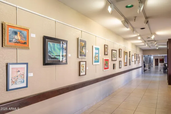 a kitchen with a sink window and cabinets