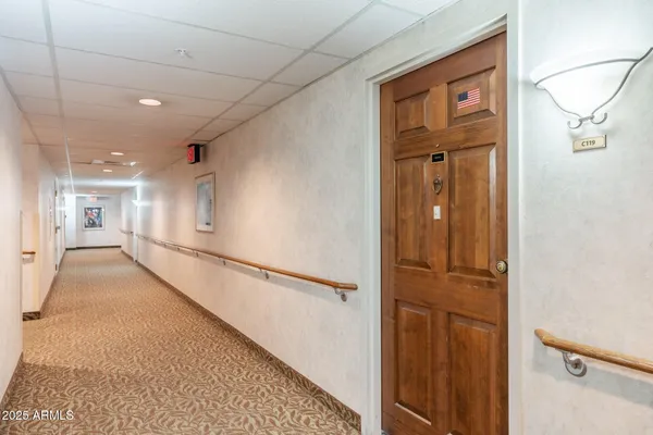 a kitchen with stainless steel appliances granite countertop a sink dishwasher a stove microwave and cabinets with wooden floor