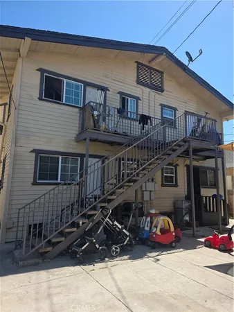a front view of a house with parking space