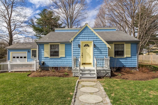 9 Orchard Road Hamilton, MA 01982 - Photo 1 of 22 a front view of a house with a garden and yard