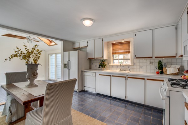 9 Orchard Road Hamilton, MA 01982 - Photo 12 of 22 a kitchen with stainless steel appliances granite countertop a refrigerator sink and white cabinets