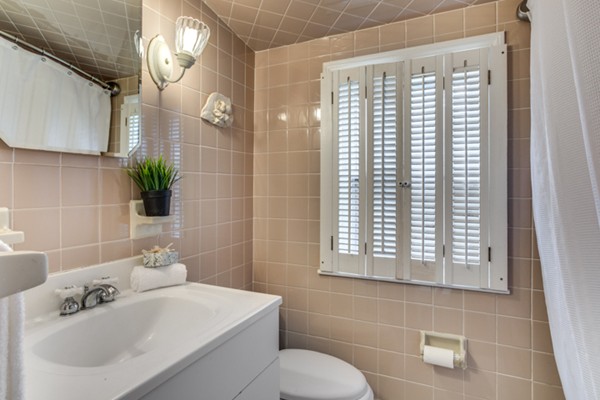 9 Orchard Road Hamilton, MA 01982 - Photo 19 of 22 a bathroom with a sink a toilet and a mirror